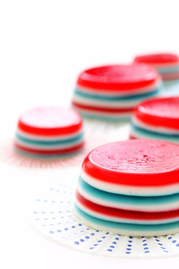 Fourth of July jello shooters in clear cups with three set layers of red, white and blue for a party