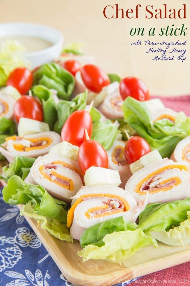 Chef salad on a stick party appetizer, rolled deli meat and cheese on toothpicks with tomatoes and cucumber