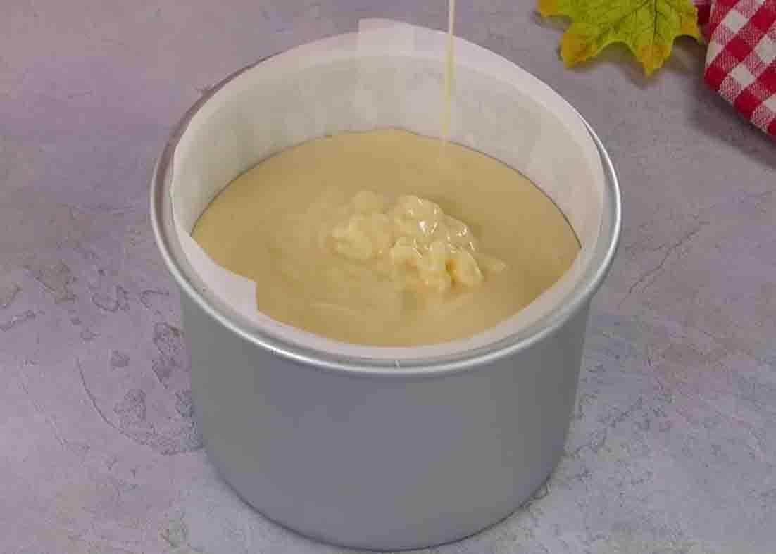 Adding the sponge cake batter to the cake pan