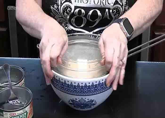 Draining the canned chicken
