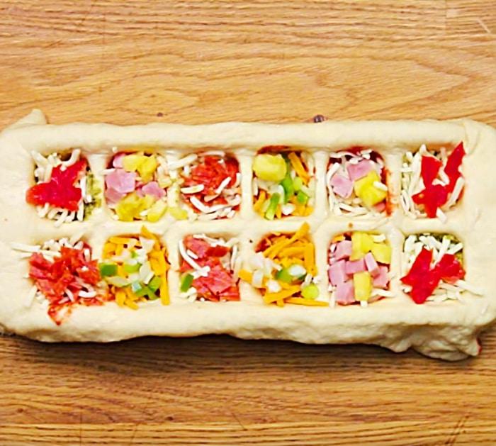 Learn to make these bite sized ice cube pizza treats for your next potluck party
