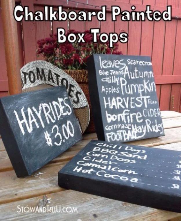 Chalkboard painted shoe box lids lettered in white chalk with fall words, titled chalkboard painted box tops