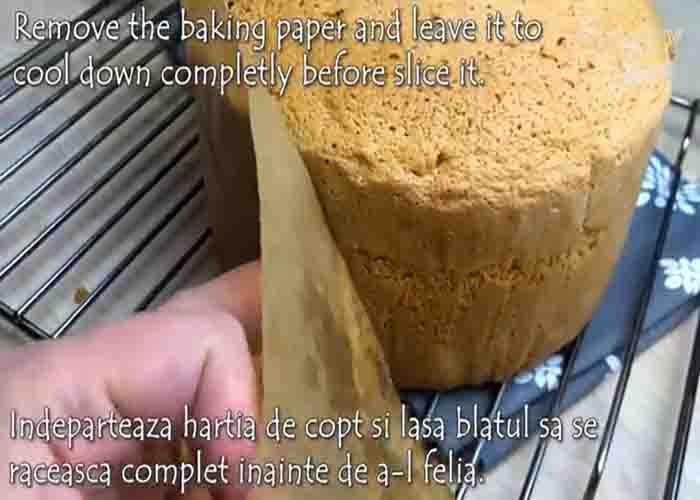 Peeling off the baking paper from the sponge cake