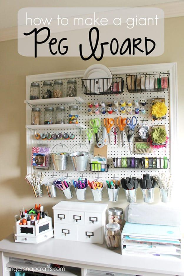 Framed white pegboard above a desk hung with baskets, tins and buckets, under a typeset Peg Board title