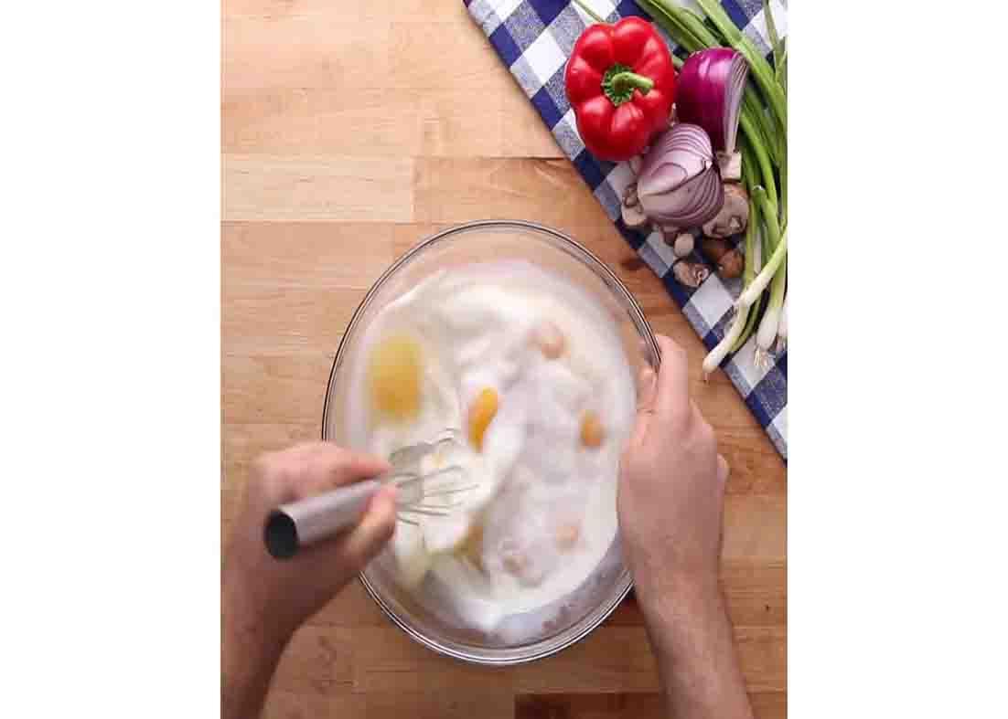 Whisking the eggs for the sheet pan eggs recipe