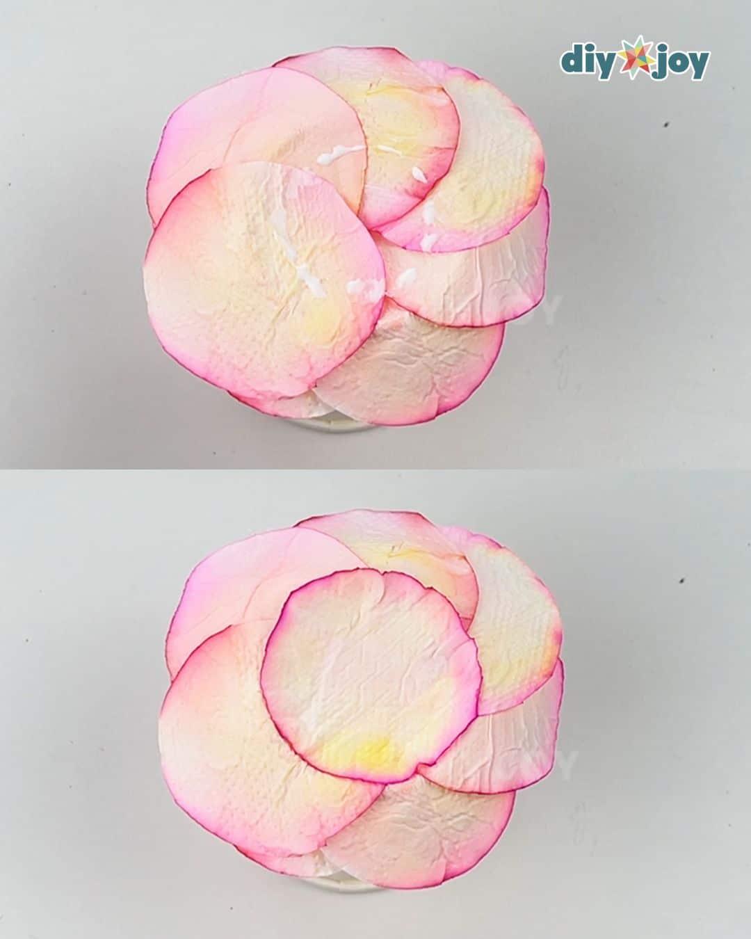 Adding the bottom cover to a homemade toilet paper rose, a green base layer finishing the flower underneath