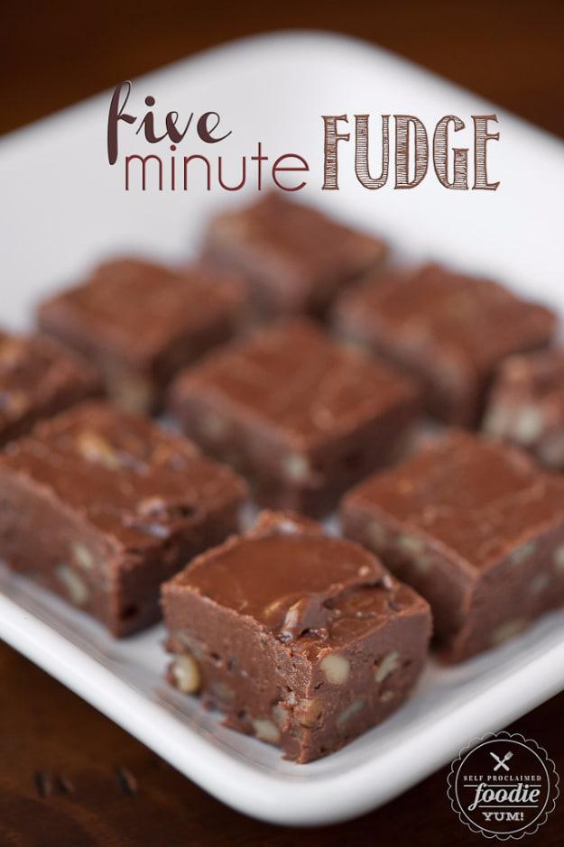 5 minute microwave fudge with walnuts, cut into squares on parchment, a fast last minute dessert idea