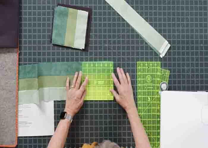 Sub cutting the strip set to make the shadow play quilt blocks