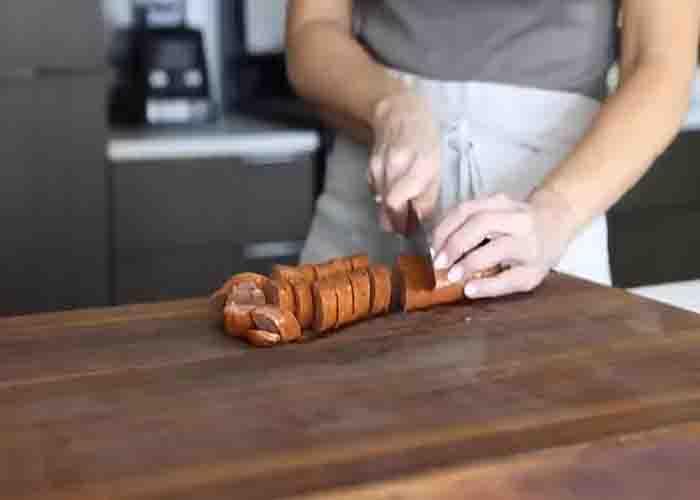 Slicing the andouille sausage for the jambalaya recipe