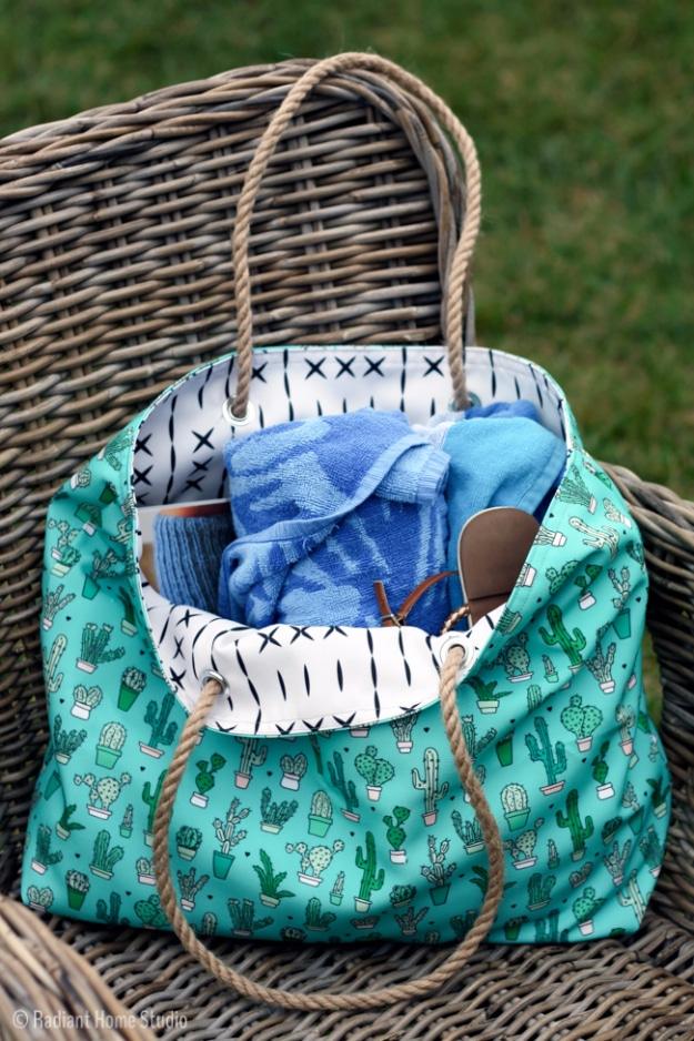 A striped cotton tote with thick rope straps hanging from a shoulder, packed with a towel, a handmade shop staple