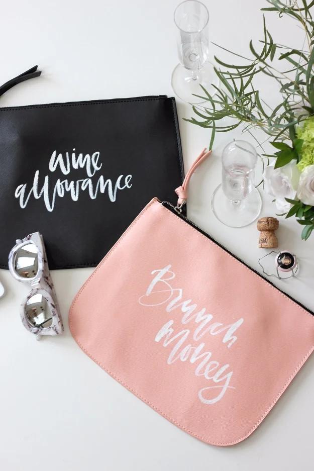 Black and blush faux leather pouches hand lettered wine allowance and brunch money beside champagne glasses
