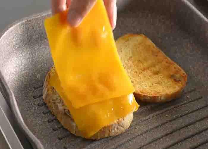 Assembling the tuna melt sandwich