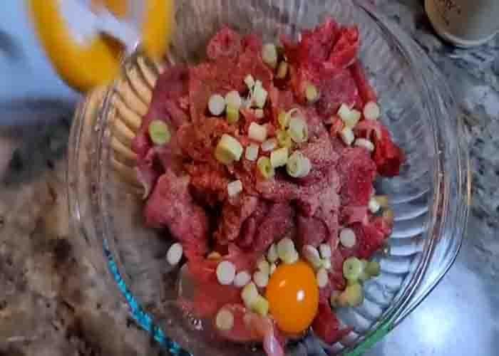 Marinating the beef before stir frying it