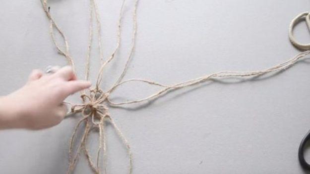Macrame Hanging Mason Jar, a handmade touch that adds texture to any wall and a budget friendly way to try a new fiber craft