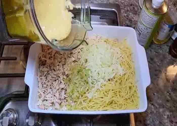 Assembling the buffalo chicken spaghetti