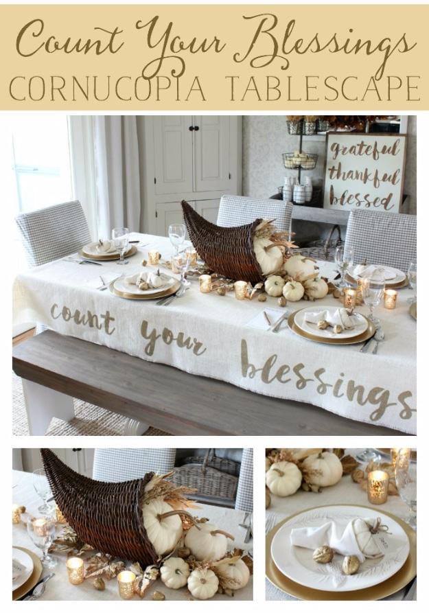 Count your blessings cornucopia centerpiece spilling squash and gourds across a Thanksgiving table with tags