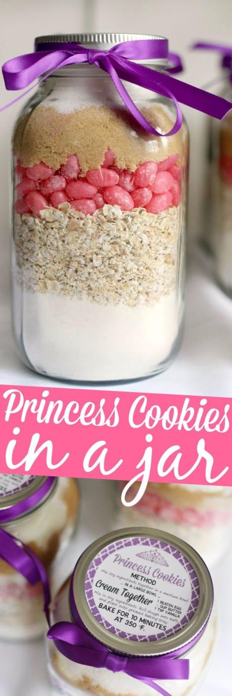 Quart mason jar of princess cookie mix with a bright pink candy layer and a purple ribbon on the top
