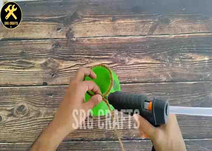 Wrapping the plastic ball with coir rope