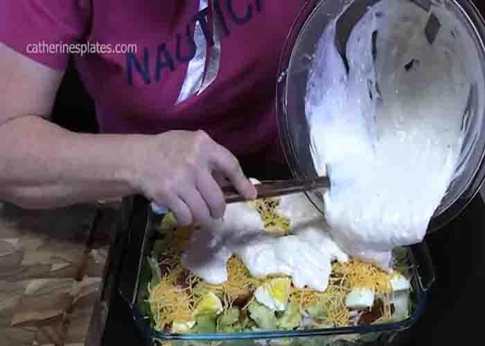 Assembling the cake pan springtime salad recipe