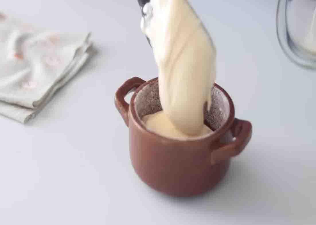 Pouring the souffle batter to the molds