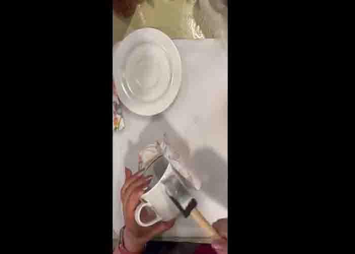 Decoupage the napkin into the teacup