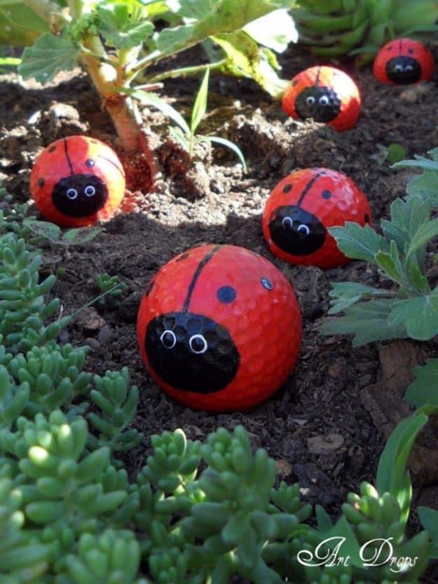 Golf Ball Ladybugs, a budget friendly way to dress up a flower bed and a clever outdoor decor idea anyone can build
