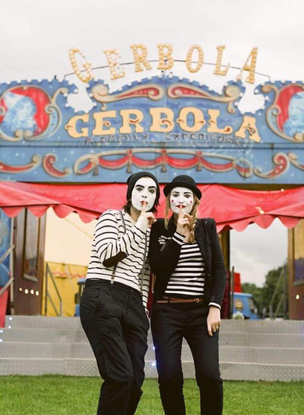 Mime couples Halloween costume with striped shirts, suspenders, white face paint and matching red lips
