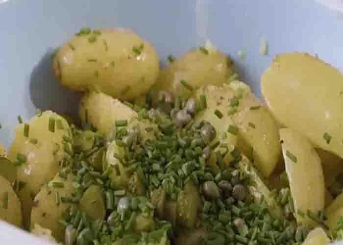 Mixing the ingredients for the potato salad