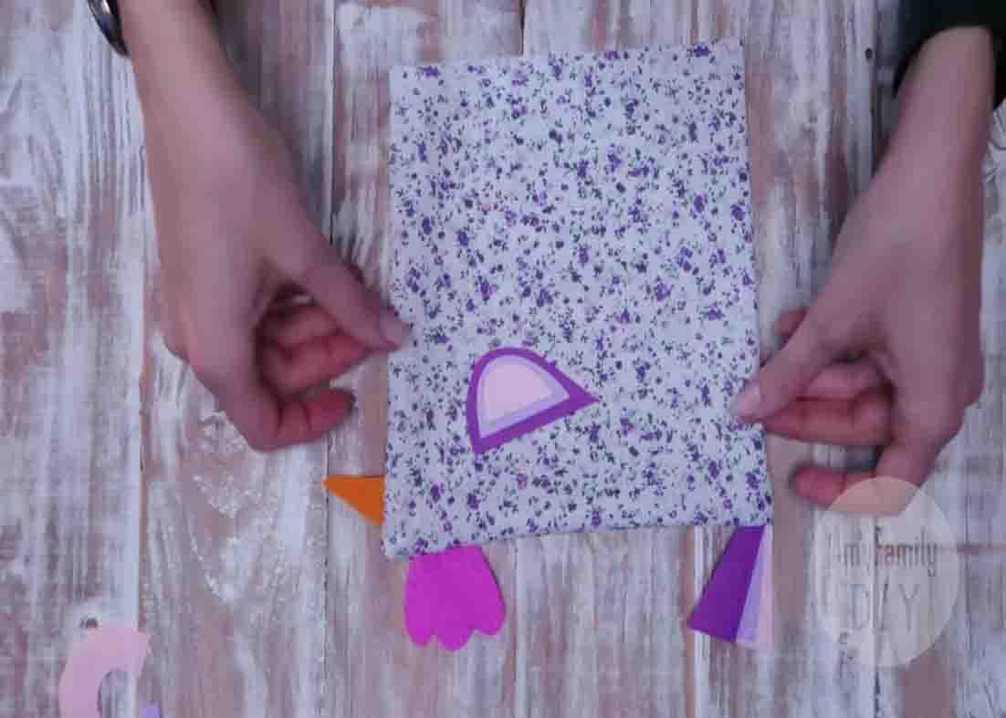 Placing the wings of the DIY Easter chicks