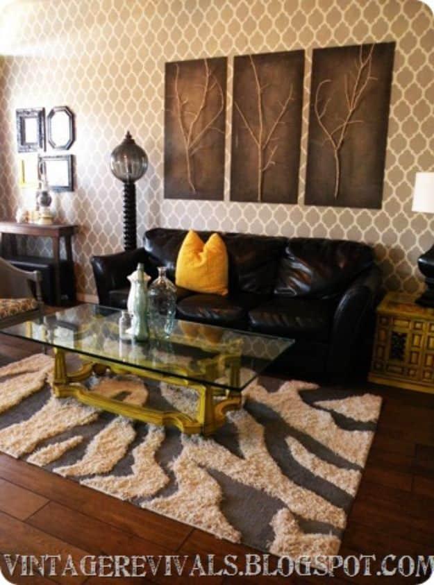 Cream and brown zebra stripe DIY rug made from two cut and swapped rugs under a glass coffee table in a living room