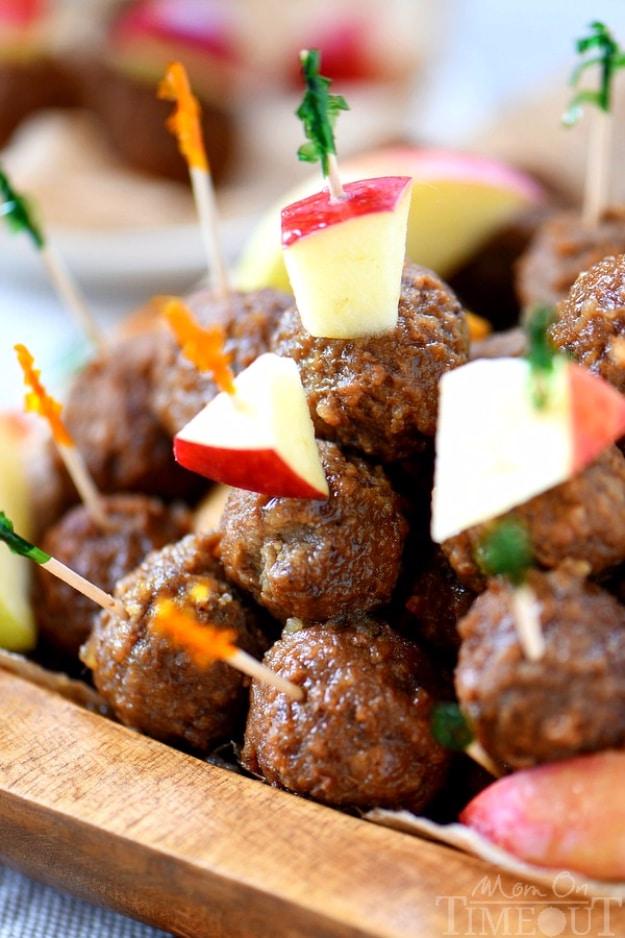 Glazed apple cider maple meatballs topped with apple cubes and toothpicks for an easy holiday appetizer