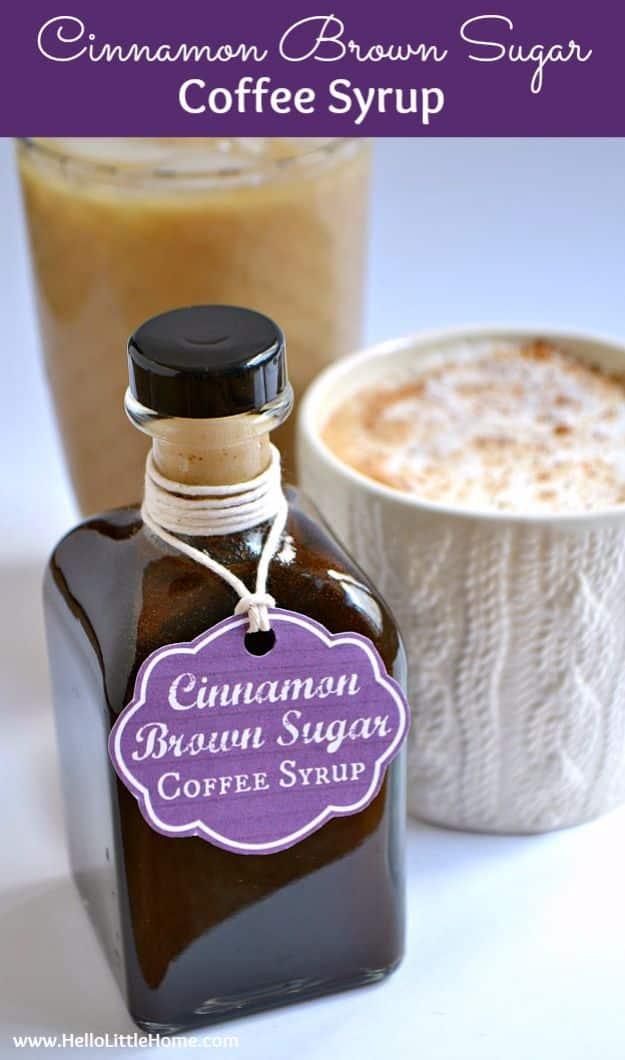 Cinnamon brown sugar coffee syrup in a dark glass bottle with a tag, beside a latte and an iced coffee