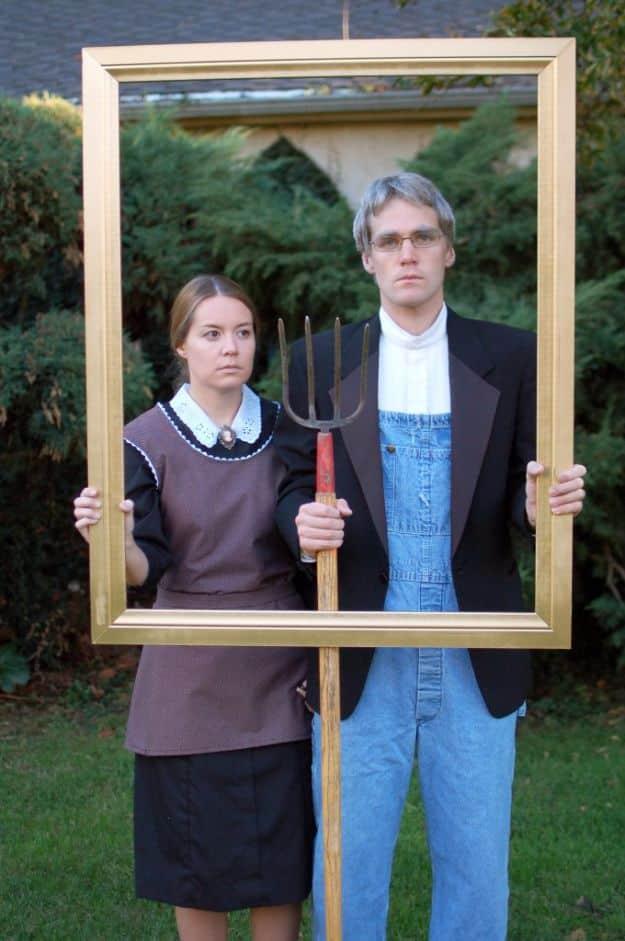 American Gothic couples costume with a gold painted wooden frame, a black lace collar dress and a pitchfork