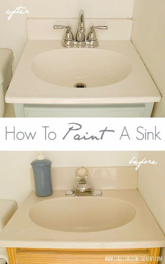 Bathroom vanity sink painted white above the dated cream sink before it, with a chrome tap and a soap dispenser