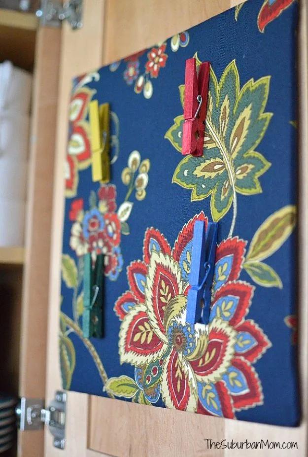 Corkboard wrapped in fabric for a softer, patterned bulletin board for anyone who wants an easy weekend project to try