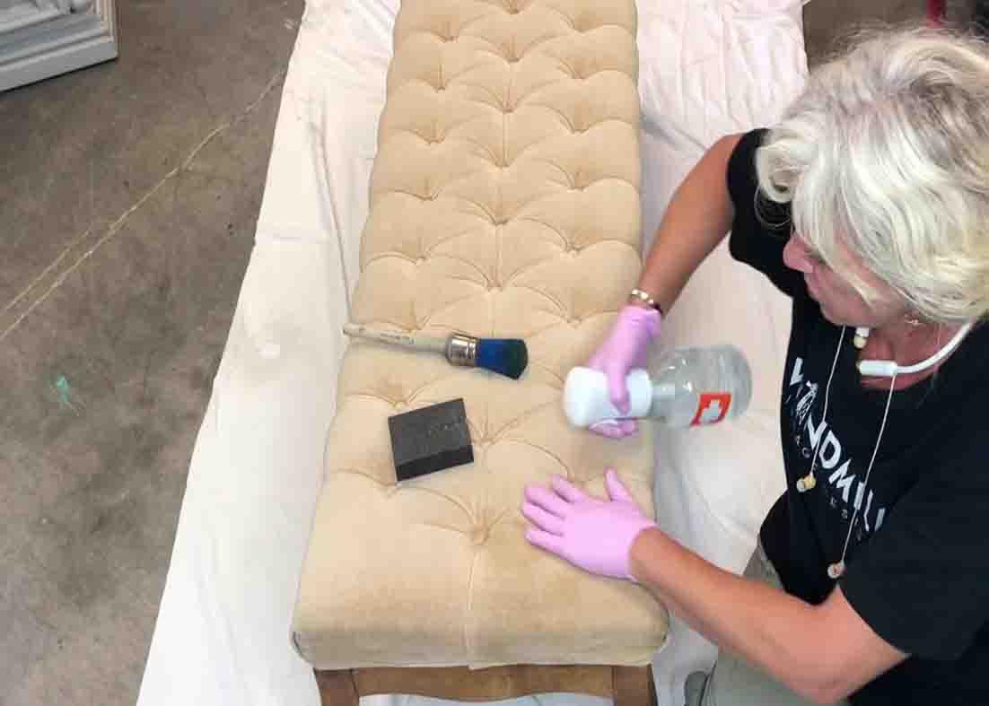 Spraying water to the upholstery before applying paint