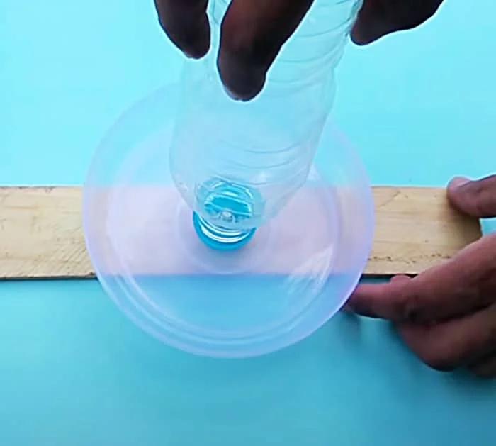 Use A Piece Of Wood And A Plastic Water Bottle To Make A Bird Water Feeder