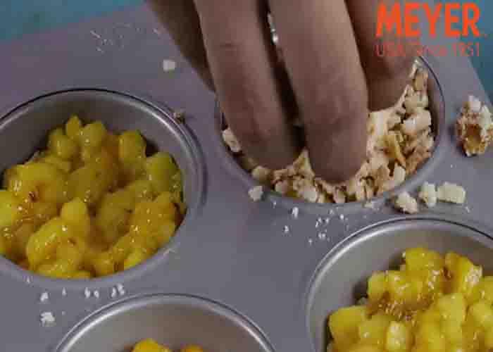Assembling the apple crumble muffins