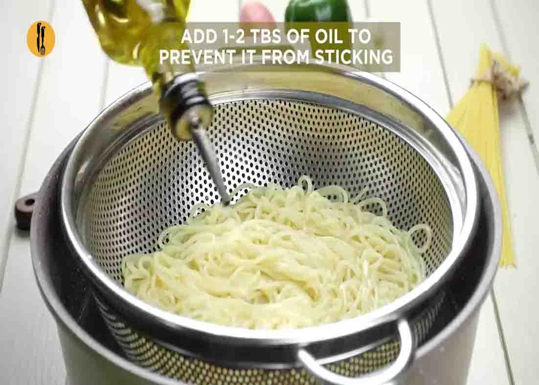 Adding some cooking oil to the chicken chow mein noodles
