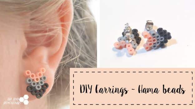 Perler bead earrings, small grey and blush fused bead stud earrings worn in an ear, beside the loose pair