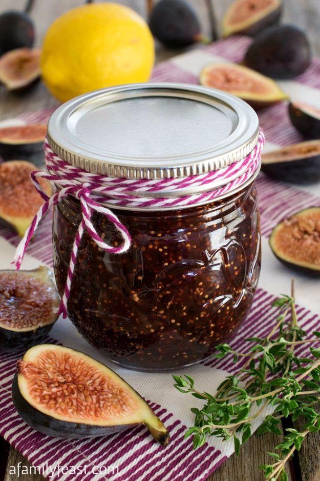 Small batch fig jam in an eight ounce jar with fresh Black Mission figs, lemon rind and sprigs of thyme