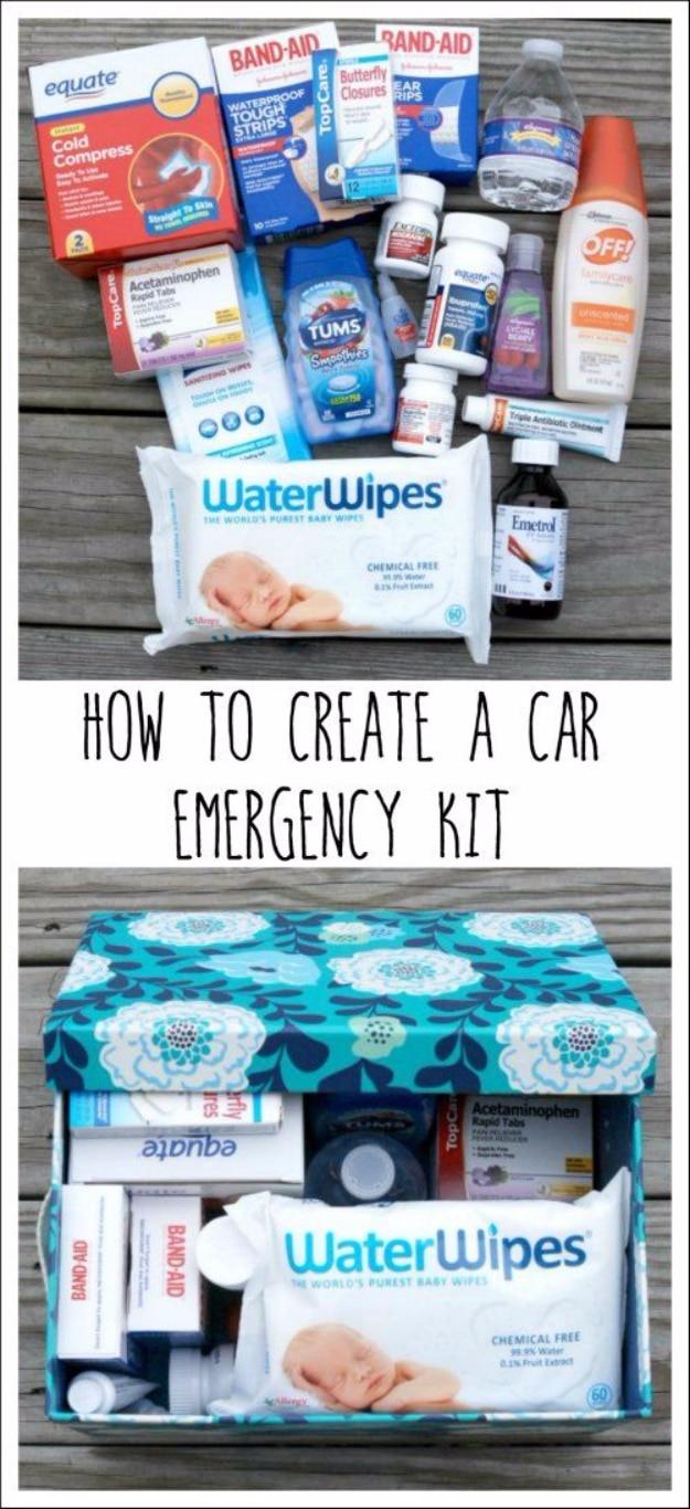 Bandages, wipes, medicines and a water bottle laid on decking above the same supplies packed in a floral fabric box