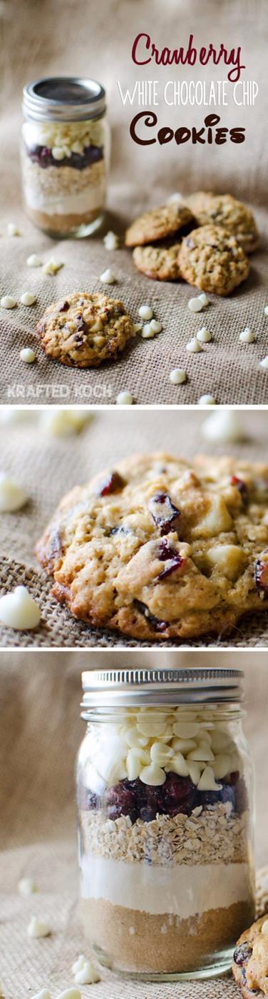 Pint mason jar of cranberry white chocolate cookie mix with a printable label and baked cookies beside it
