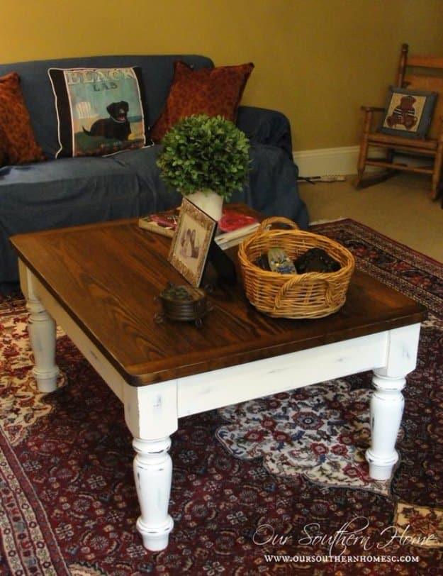 Farmhouse coffee table with a warm stained wood top and a distressed creamy white painted base on a patterned rug