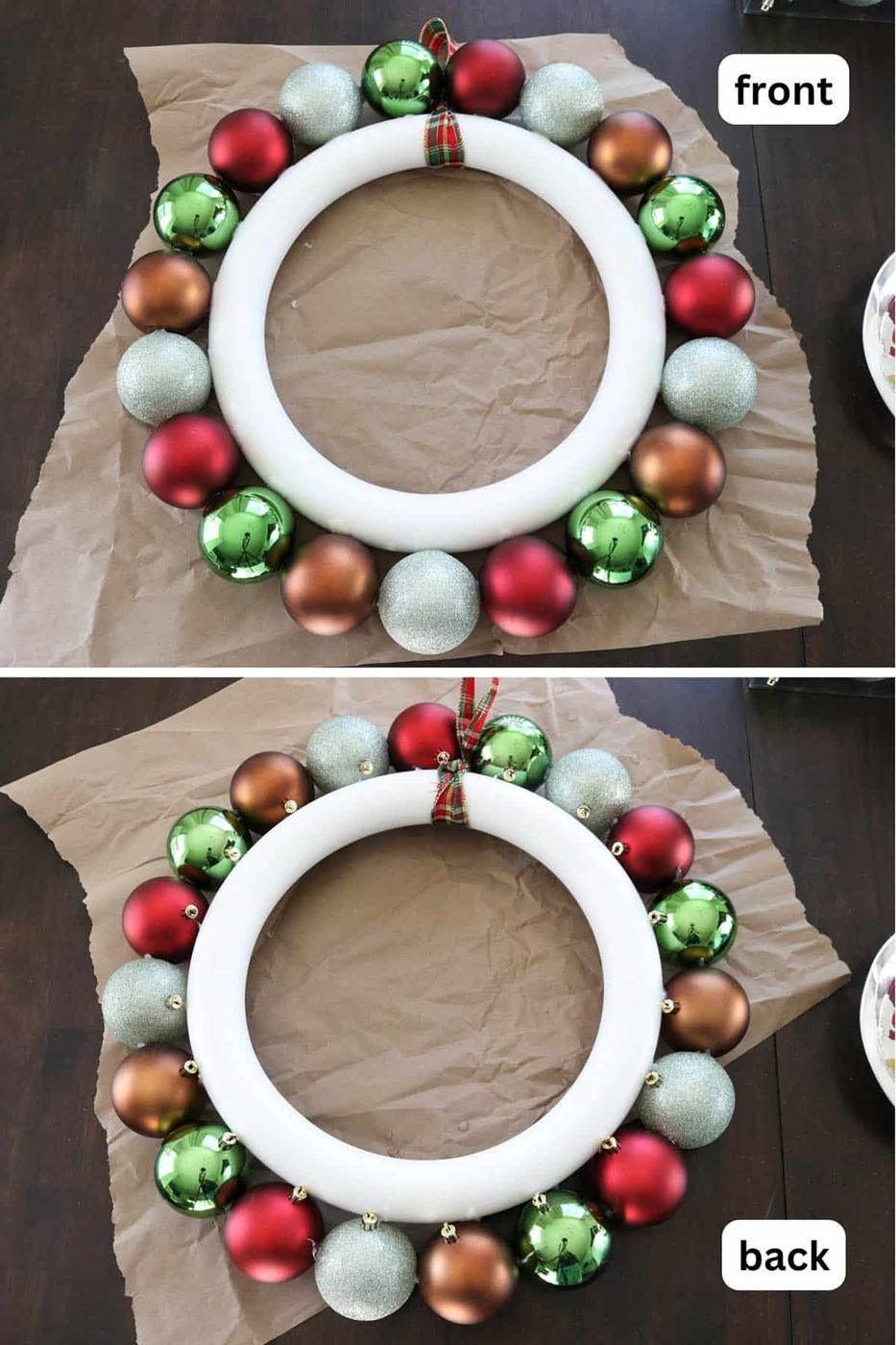 Round Christmas wreath covered in shatterproof ball ornaments in red, green, gold and white, hanging on a front door