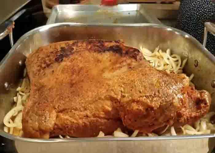 Searing the brisket over the stove