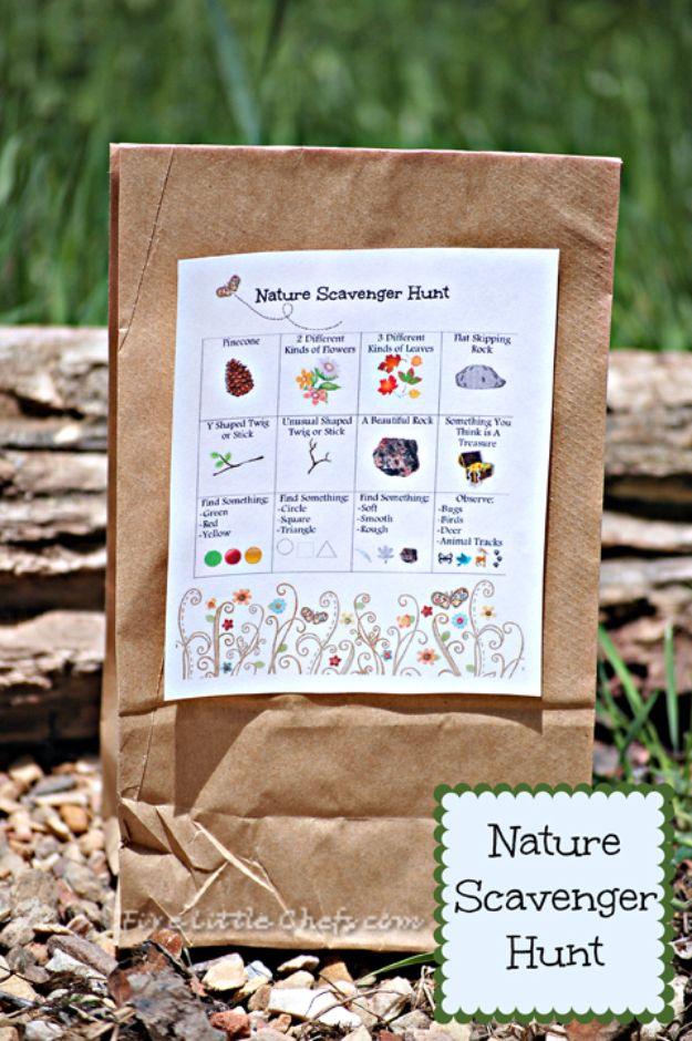 Nature scavenger hunt printable card with pictures and words clipped to a brown paper collecting bag outdoors