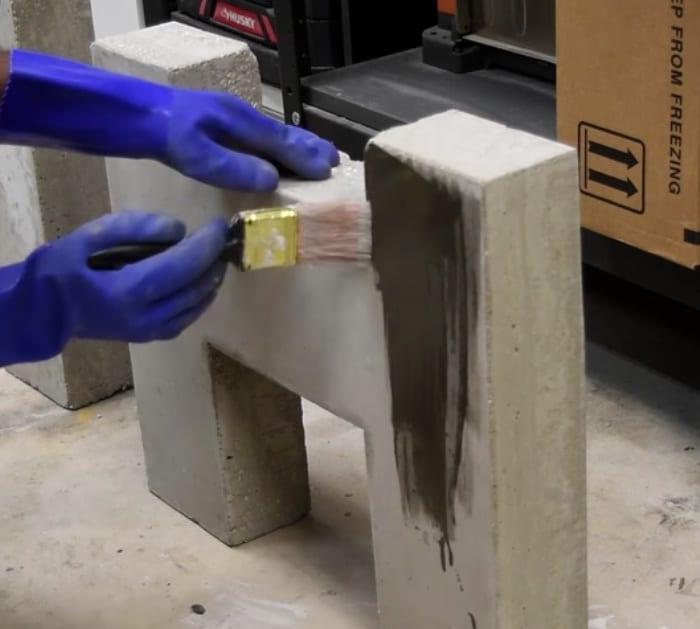 Make a modern style concrete and wood bench