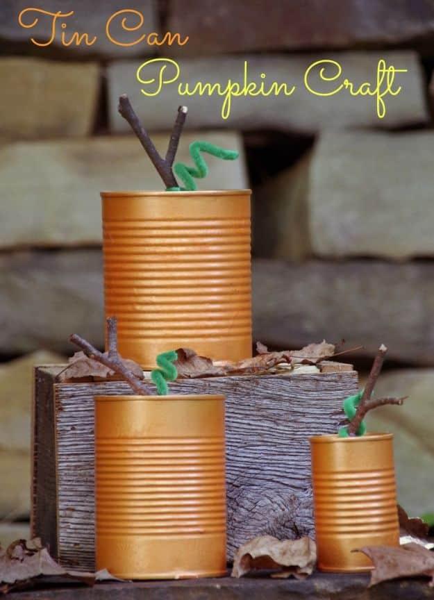 Pin graphic reading Tin Can Pumpkin Craft, three orange painted cans with twig stems and green pipe cleaner vines