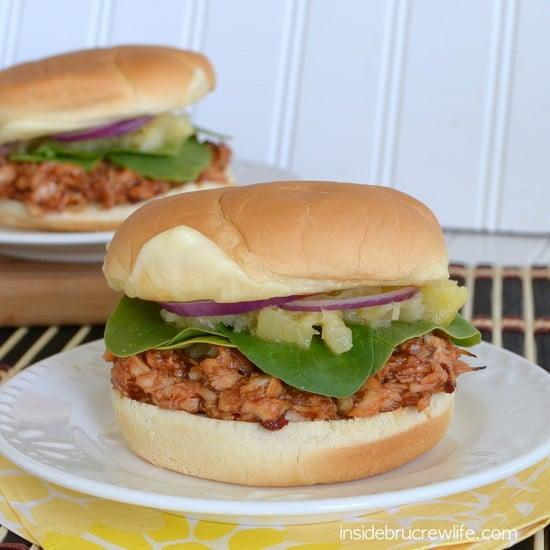 Chipotle BBQ chicken sandwich on a soft bun with pineapple, spinach, red onion and melted mozzarella